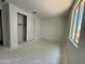 Bright bedroom with closet and natural light from a window, featuring smooth walls and trim waiting for personal touches at 3013 E Mecklenburg Way, San Tan Valley, AZ 85143