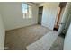 Inviting bedroom featuring a closet, neutral carpet, and a large window at 3013 E Mecklenburg Way, San Tan Valley, AZ 85143