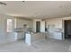 Bright, spacious kitchen features recessed lighting, a large island, and ample white cabinetry for storage and culinary creations at 3013 E Mecklenburg Way, San Tan Valley, AZ 85143