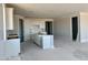 Bright, spacious kitchen features recessed lighting, a large island, and ample white cabinetry for storage and culinary creations at 3013 E Mecklenburg Way, San Tan Valley, AZ 85143