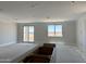An open-concept living area, brightened by natural light, offering seamless access to outdoor space through sliding glass doors at 3013 E Mecklenburg Way, San Tan Valley, AZ 85143