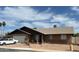 Lovely single-story brick home with a well-kept lawn and inviting curb appeal at 3106 E Grove Ave, Mesa, AZ 85204