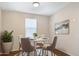 Cozy dining area with a round table, stylish chairs, and a decorative plant at 320 E Mckellips Rd # 163, Mesa, AZ 85201