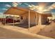 This home's exterior features a covered carport and desert landscaping at 320 E Mckellips Rd # 163, Mesa, AZ 85201