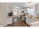 Well-lit kitchen with stainless steel appliances, granite countertops, and ample cabinet space at 320 E Mckellips Rd # 163, Mesa, AZ 85201