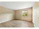Bright bedroom with wood-look flooring and a view of a fenced patio at 3314 N 68Th St # W112, Scottsdale, AZ 85251