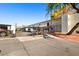 Apartment complex with gated entrance and lush landscaping on a sunny day at 3314 N 68Th St # W112, Scottsdale, AZ 85251