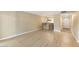 Open-concept living space featuring wood flooring and a view of the kitchen at 3314 N 68Th St # W112, Scottsdale, AZ 85251