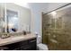 A bathroom with granite counters, a sink, and a sliding glass door shower at 35443 N 87Th Pl, Scottsdale, AZ 85266