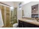 Bathroom featuring a glass shower and granite vanity at 35443 N 87Th Pl, Scottsdale, AZ 85266