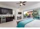 Bedroom featuring kitchenette, desk, and patio access at 35443 N 87Th Pl, Scottsdale, AZ 85266