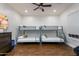 A bunk room offers two sets of bunk beds and dark wood floors at 35443 N 87Th Pl, Scottsdale, AZ 85266