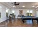 Spacious game room with a billiard table and adjacent seating, perfect for entertaining at 35443 N 87Th Pl, Scottsdale, AZ 85266