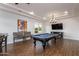 Entertaining game room featuring a billiard table, mounted TV, and comfortable seating area at 35443 N 87Th Pl, Scottsdale, AZ 85266