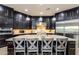 Gourmet kitchen features granite counters, stainless steel appliances, and a center island with seating at 35443 N 87Th Pl, Scottsdale, AZ 85266