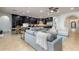 An expansive living room and dining area with dark cabinets and tile floors at 35443 N 87Th Pl, Scottsdale, AZ 85266