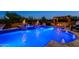 Inviting pool with fire bowls, spa, and covered dining area creates a luxurious outdoor oasis for relaxation and entertainment at 35443 N 87Th Pl, Scottsdale, AZ 85266