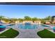 Inviting pool with water features, lush landscaping, and comfortable lounge areas for relaxation at 35443 N 87Th Pl, Scottsdale, AZ 85266