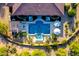 Aerial view showcasing a luxurious pool with water features, lounge seating and cabanas at 35443 N 87Th Pl, Scottsdale, AZ 85266