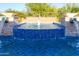 Up-close view of the pool's water feature and tile design at 35443 N 87Th Pl, Scottsdale, AZ 85266