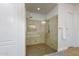 Glass-enclosed shower with dual shower heads and tile surround in the primary ensuite bathroom at 35443 N 87Th Pl, Scottsdale, AZ 85266
