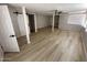Spacious finished basement featuring modern flooring, neutral paint, and versatile layout options at 3933 E Flower St, Phoenix, AZ 85018
