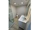 Clean modern bathroom with black fixtures, glass shower, and illuminated mirror at 3933 E Flower St, Phoenix, AZ 85018