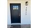 The front door is a dark color that complements the white brick exterior at 3933 E Flower St, Phoenix, AZ 85018