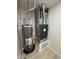 Close up view of water heater and furnace in a utility closet, with light-colored flooring at 3933 E Flower St, Phoenix, AZ 85018