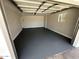 A clean two car garage with new epoxy floor at 3933 E Flower St, Phoenix, AZ 85018