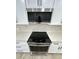 Modern stainless steel appliances, including a sleek cooktop and microwave, in kitchen at 3933 E Flower St, Phoenix, AZ 85018