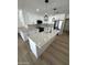Modern kitchen with stainless steel appliances, quartz countertops, and a central island at 3933 E Flower St, Phoenix, AZ 85018