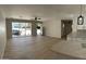 Open-concept living area with large windows and bright kitchen boasts a seamless flow at 3933 E Flower St, Phoenix, AZ 85018
