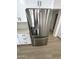 Stainless steel refrigerator with water and ice dispenser complements the kitchen's design at 3933 E Flower St, Phoenix, AZ 85018