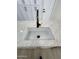 Modern white kitchen sink with black faucet and quartz countertops at 3933 E Flower St, Phoenix, AZ 85018
