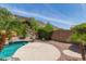 Beautiful backyard with refreshing private pool, desert landscaping, and privacy wall at 408 E Silverwood Dr, Phoenix, AZ 85048