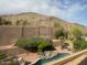 Inviting backyard pool with desert landscaping and mountain views for a serene outdoor living experience at 408 E Silverwood Dr, Phoenix, AZ 85048