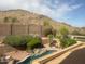 Inviting backyard pool with desert landscaping and mountain views for a serene outdoor living experience at 408 E Silverwood Dr, Phoenix, AZ 85048