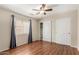 Bedroom featuring hardwood floors, a closet, a window, and neutral paint at 408 E Silverwood Dr, Phoenix, AZ 85048