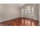 Bright bedroom with wood floors and window with bright natural light at 408 E Silverwood Dr, Phoenix, AZ 85048