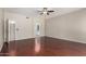 This bedroom has hardwood floors and access to the ensuite bathroom at 408 E Silverwood Dr, Phoenix, AZ 85048