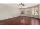 Spacious bedroom with hardwood floors, ceiling fan, and bright natural light at 408 E Silverwood Dr, Phoenix, AZ 85048