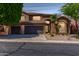 Charming two-story home featuring a three-car garage and desert landscaping at 408 E Silverwood Dr, Phoenix, AZ 85048