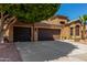 Two-story home featuring a spacious three-car garage and mature landscaping at 408 E Silverwood Dr, Phoenix, AZ 85048