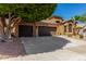 Spacious two-story home featuring a large three-car garage and desert landscaping at 408 E Silverwood Dr, Phoenix, AZ 85048