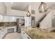 Spacious kitchen with white cabinets, granite countertops, and stainless steel appliances at 408 E Silverwood Dr, Phoenix, AZ 85048