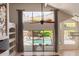 Open living area with pool view, ceiling fan, and stylish curtains at 408 E Silverwood Dr, Phoenix, AZ 85048