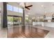 Bright living room with wood floors, high ceilings, and access to a backyard pool view at 408 E Silverwood Dr, Phoenix, AZ 85048