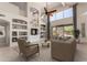 Inviting living room with vaulted ceiling, ceiling fan, built in shelving and neutral decor at 408 E Silverwood Dr, Phoenix, AZ 85048