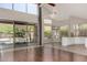 Bright living room with wood floors, high ceilings, and access to a backyard pool view at 408 E Silverwood Dr, Phoenix, AZ 85048